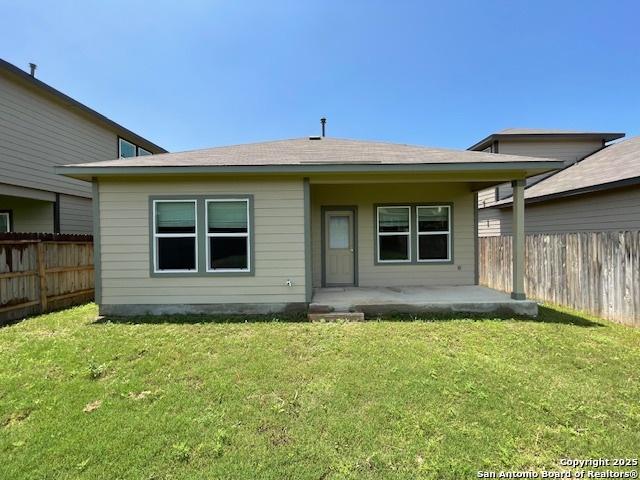 rear view of property featuring a porch