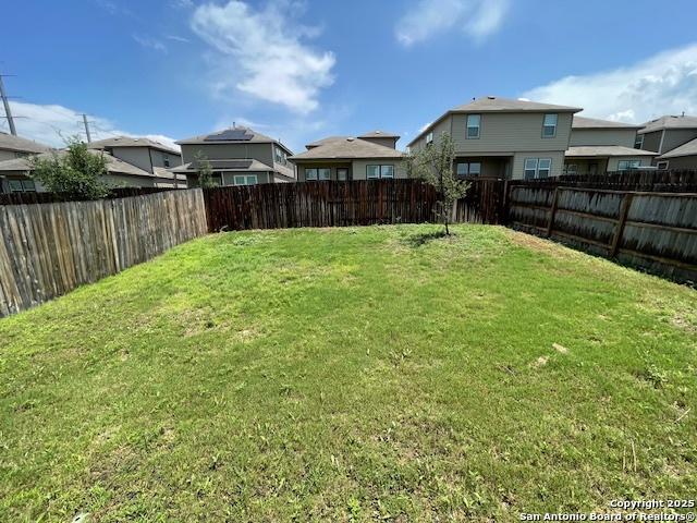 view of yard with a residential view