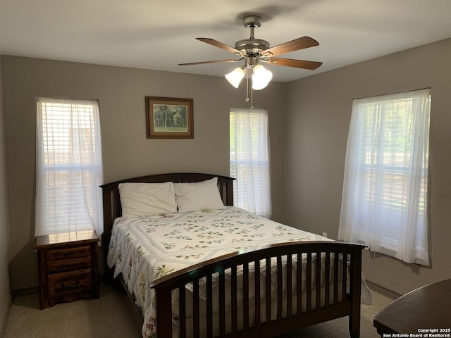 bedroom with carpet floors and a ceiling fan