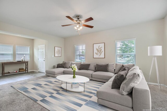 1109 Esplanade Pkwy, San Marcos, TX 78666 - living area with carpet floors, plenty of natural light, ceiling fan, and baseboards