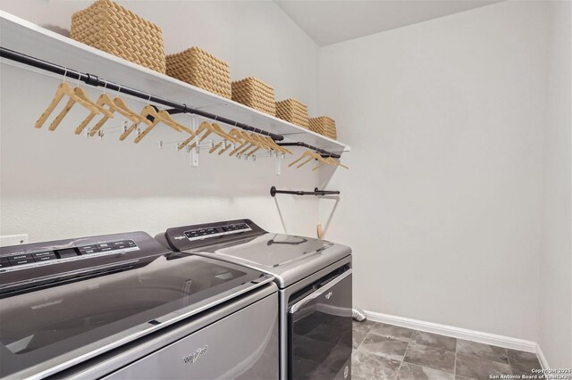 1109 Esplanade Pkwy, San Marcos, TX 78666 - clothes washing area featuring washing machine and clothes dryer and baseboards