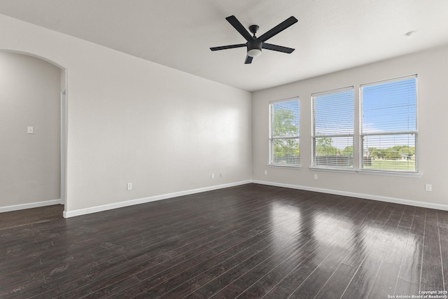 3727 Columbia, Cibolo, TX 78108 - empty room with ceiling fan, dark wood-style flooring, arched walkways, and baseboards