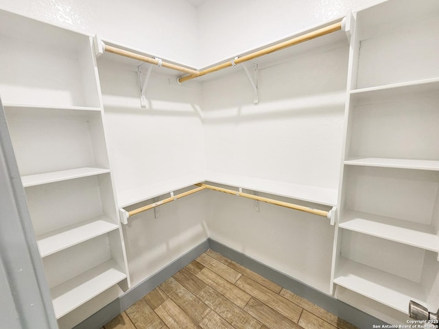 spacious closet with wood finished floors