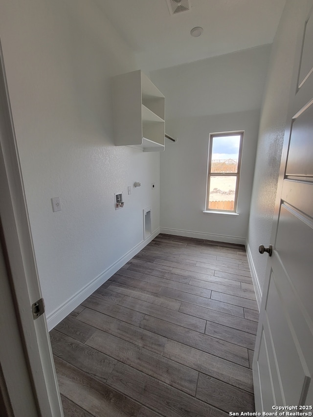 14074 May Mist, San Antonio, TX 78253 - laundry room with dark wood-type flooring, electric dryer hookup, and baseboards