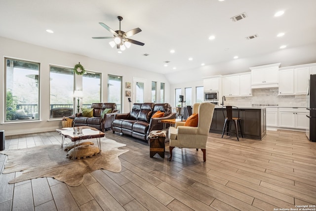 14074 May Mist, San Antonio, TX 78253 - living area featuring light wood finished floors, ceiling fan, and recessed lighting
