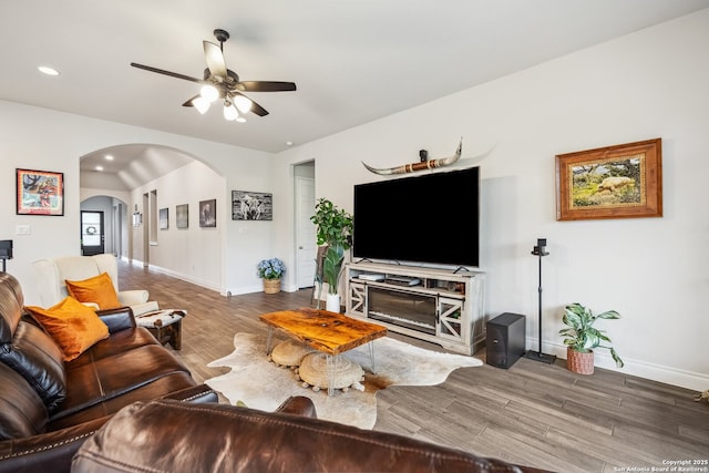 14074 May Mist, San Antonio, TX 78253 - living area featuring arched walkways, wood finished floors, baseboards, ceiling fan, and recessed lighting