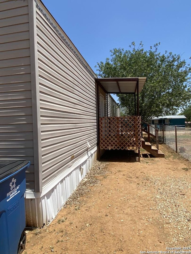 311 N Darlington, Dilley, TX 78017 - view of home's exterior featuring fence