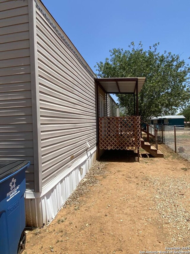 311 N Darlington, Dilley, TX 78017 - view of home's exterior featuring fence