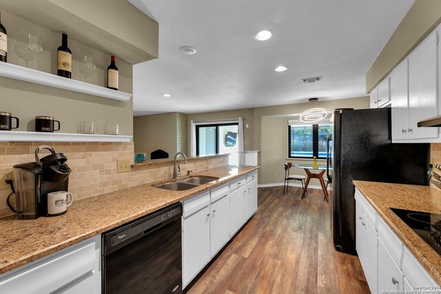 kitchen with black appliances, open shelves, a sink, tasteful backsplash, and white cabinets