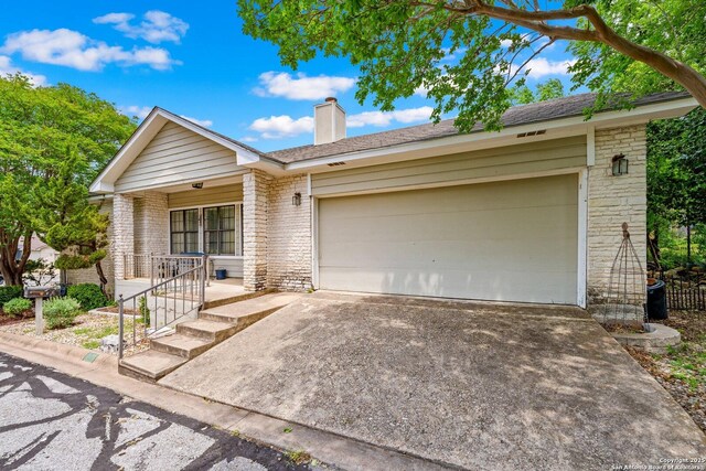 239 Old Oaks, Kerrville, TX 78028 - single story home featuring driveway, a porch, an attached garage, and a chimney