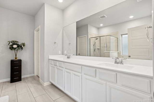 2465 Pennilynn, San Antonio, TX 78253 - full bath featuring a shower stall, double vanity, baseboards, recessed lighting, and tile patterned flooring