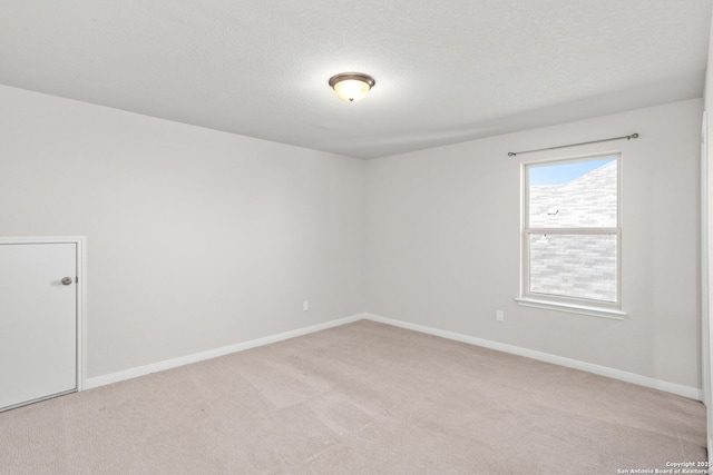 2465 Pennilynn, San Antonio, TX 78253 - unfurnished room with light colored carpet, baseboards, and a textured ceiling
