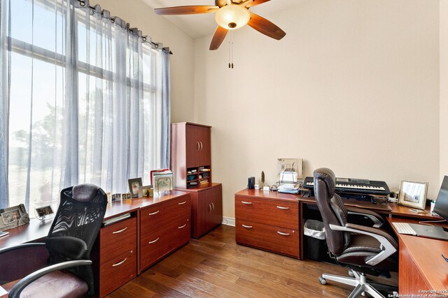 home office with a ceiling fan and wood finished floors