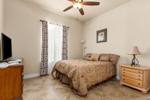 bedroom with baseboards and ceiling fan