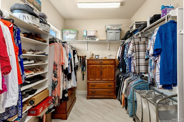 spacious closet featuring light floors