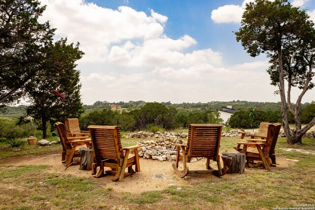 view of yard featuring an outdoor fire pit