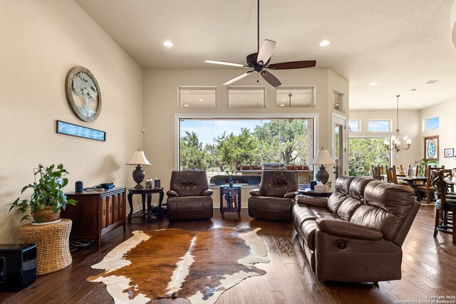 living room featuring ceiling fan, a chandelier, wood-type flooring, and recessed lighting