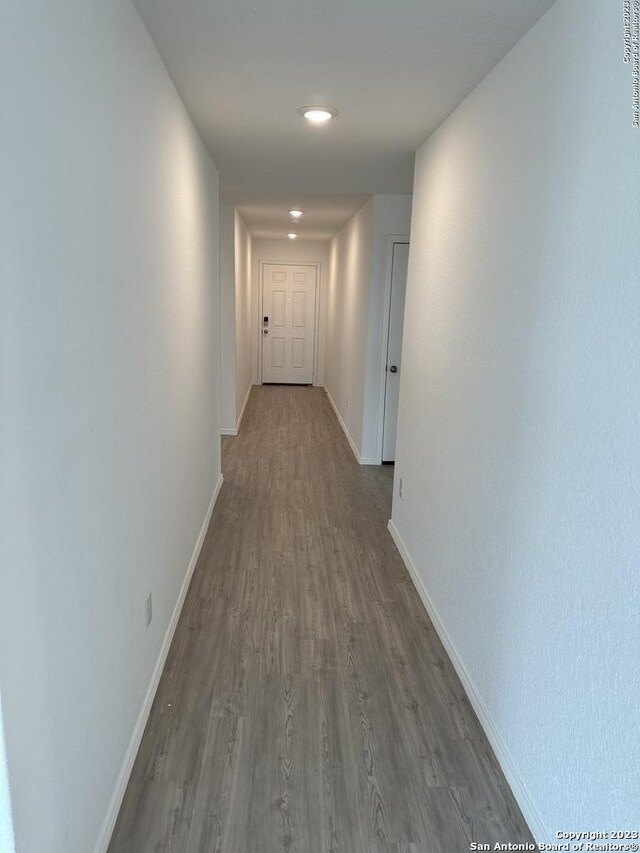 10742 Hernando Ct, Converse, TX 78109 - corridor featuring dark wood-style floors, baseboards, and recessed lighting