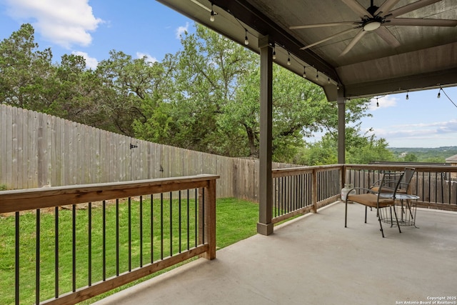 view of patio featuring ceiling fan