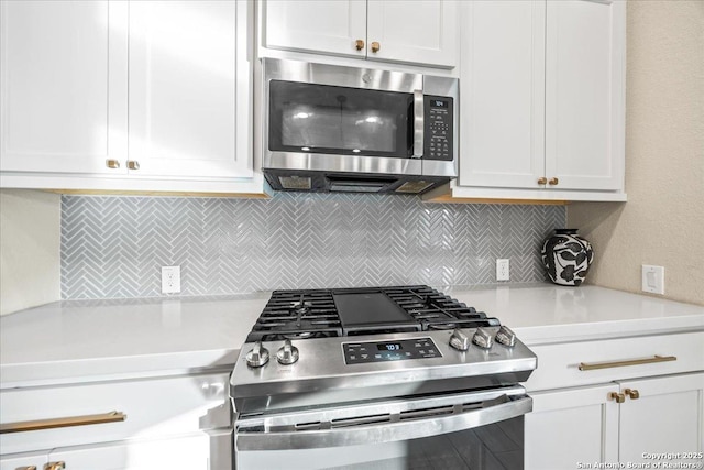 14327 Running Wolf, San Antonio, TX 78245 - kitchen with appliances with stainless steel finishes, light countertops, decorative backsplash, and white cabinets