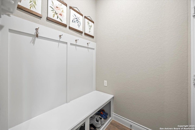 14327 Running Wolf, San Antonio, TX 78245 - mudroom with a textured wall and dark wood finished floors