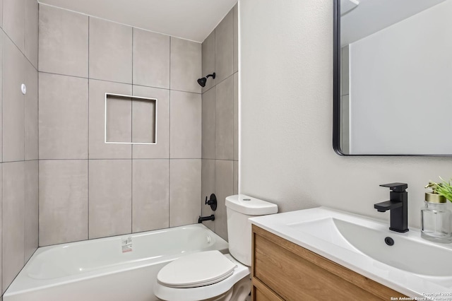 bathroom featuring toilet, shower / washtub combination, and vanity