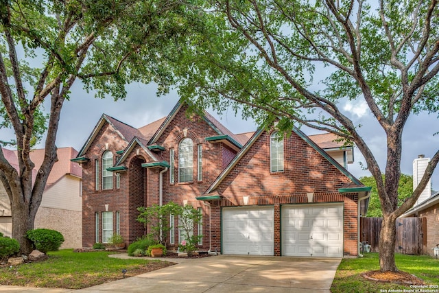 9347 Llano Verde, Helotes, TX 78023 - traditional-style home with driveway and brick siding