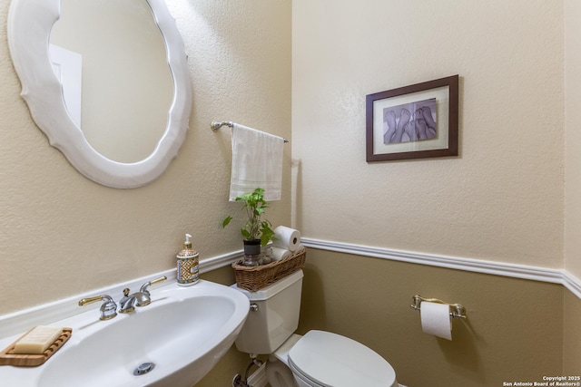 9347 Llano Verde, Helotes, TX 78023 - half bathroom with a sink and toilet