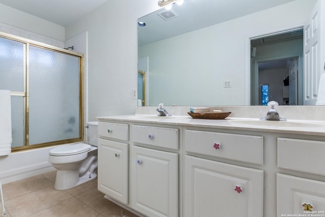 9347 Llano Verde, Helotes, TX 78023 - full bathroom featuring toilet, tile patterned floors, double vanity, and enclosed tub / shower combo