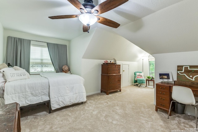 9347 Llano Verde, Helotes, TX 78023 - bedroom with multiple windows, vaulted ceiling, light colored carpet, and a ceiling fan