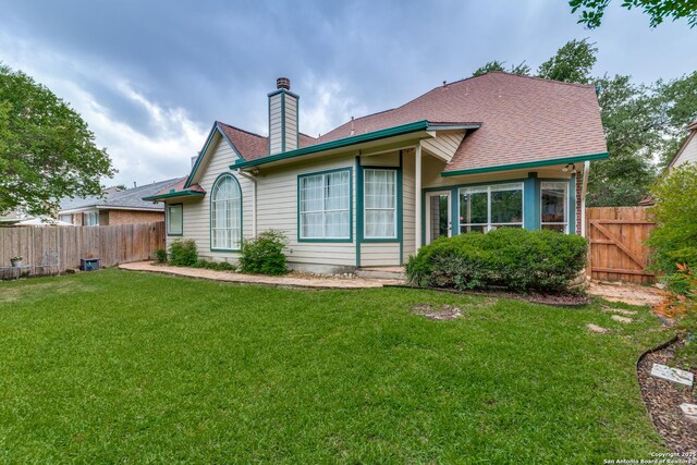 9347 Llano Verde, Helotes, TX 78023 - back of property featuring a chimney and a gate