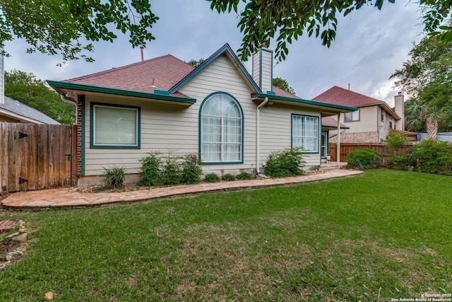 9347 Llano Verde, Helotes, TX 78023 - view of front of house with a chimney and a shingled roof