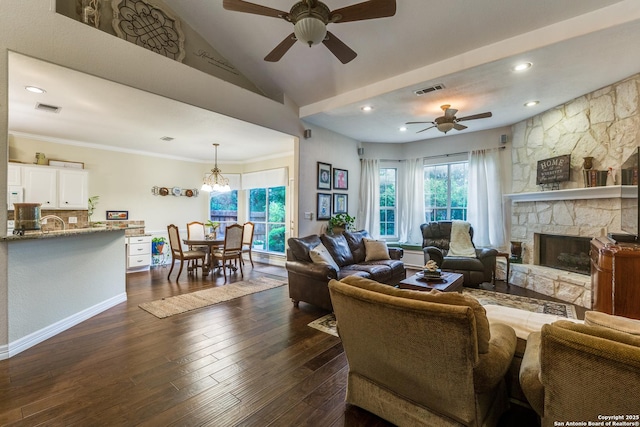 9347 Llano Verde, Helotes, TX 78023 - living room with ceiling fan, a stone fireplace, a chandelier, dark wood-style flooring, and recessed lighting
