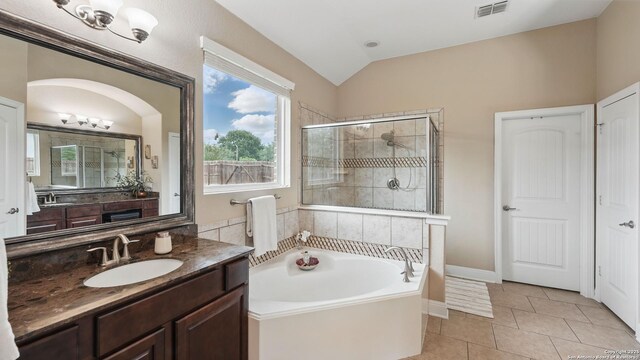 3318 Jasons, Marion, TX 78124 - full bathroom featuring a shower stall, vaulted ceiling, a bath, tile patterned flooring, and vanity