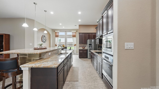 3318 Jasons, Marion, TX 78124 - kitchen featuring a sink, stainless steel appliances, a kitchen breakfast bar, a large island with sink, and dark brown cabinets