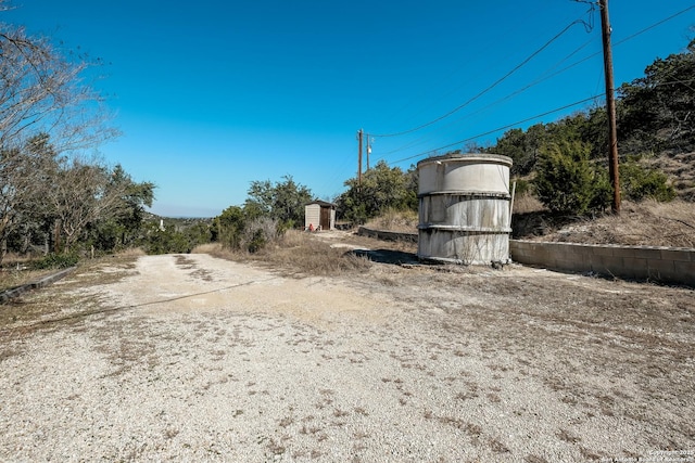 5A Rolling Acres Rd, Boerne, TX 78006 - view of yard with a storage shed and an outbuilding