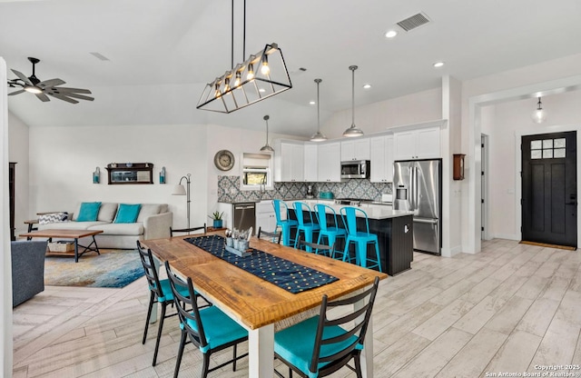 dining space with a ceiling fan, light wood-type flooring, recessed lighting, and baseboards