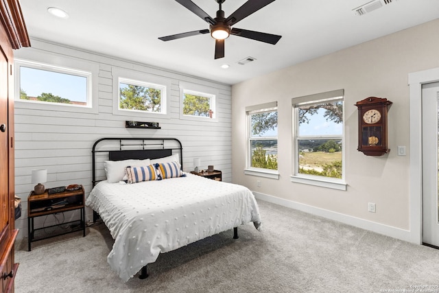 bedroom with baseboards, recessed lighting, light colored carpet, and a ceiling fan