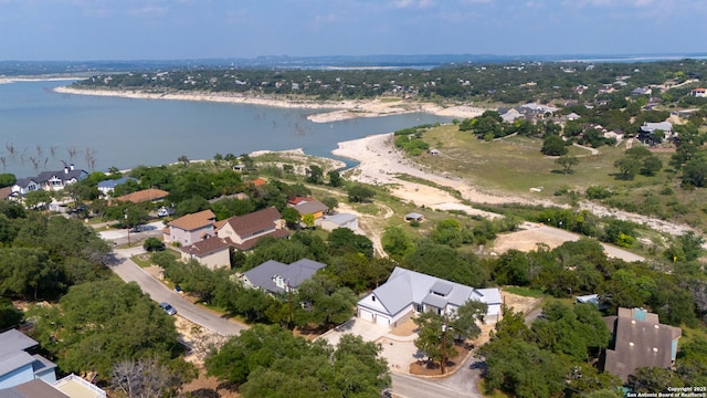 aerial view of residential area with a large body of water