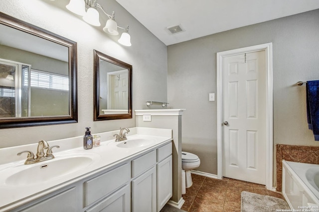 141 Glen Eagles, Cibolo, TX 78108 - bathroom featuring tile patterned flooring, a garden tub, toilet, double vanity, and baseboards