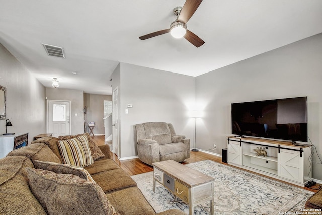 141 Glen Eagles, Cibolo, TX 78108 - living room with ceiling fan, wood finished floors, and baseboards