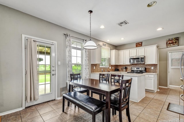 141 Glen Eagles, Cibolo, TX 78108 - dining room featuring baseboards, light tile patterned flooring, and recessed lighting