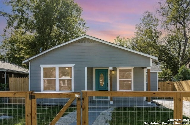 250 Oelkers, San Antonio, TX 78204 - view of front of house featuring covered porch, a fenced front yard, and a gate