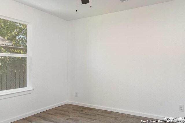 250 Oelkers, San Antonio, TX 78204 - unfurnished room with wood finished floors, baseboards, and ceiling fan