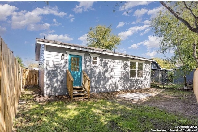 250 Oelkers, San Antonio, TX 78204 - back of property featuring entry steps and a fenced backyard
