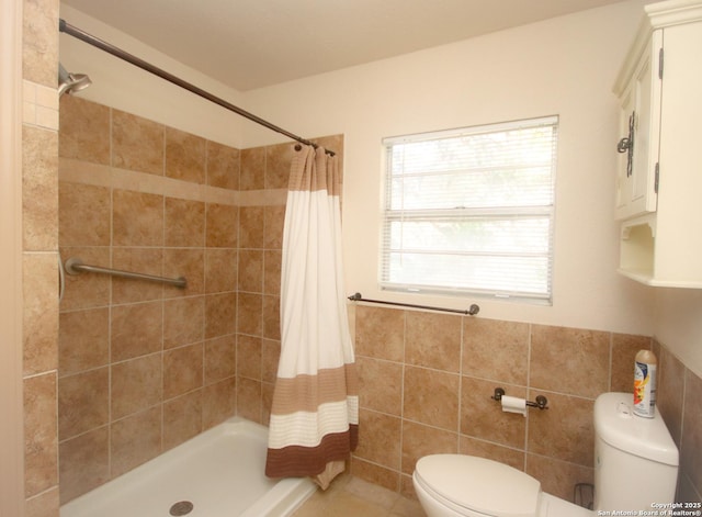 3084 Rustler, Canyon Lake, TX 78133 - bathroom with toilet, a tile shower, and tile walls