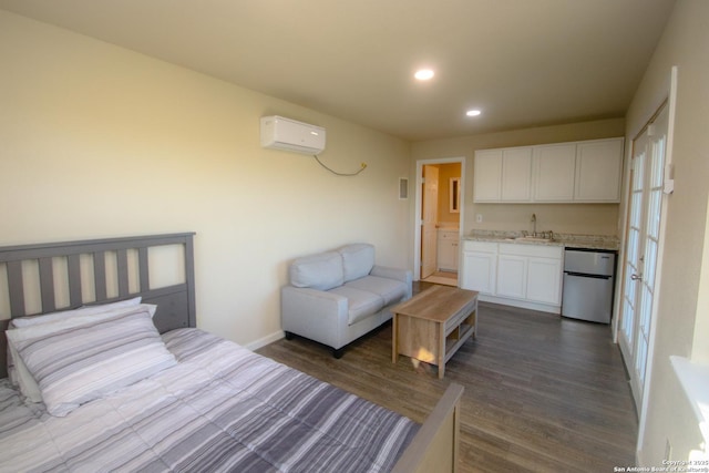 3084 Rustler, Canyon Lake, TX 78133 - bedroom with fridge, a sink, a wall unit AC, dark wood-style floors, and recessed lighting