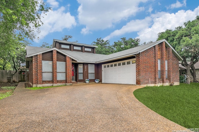 5615 Timber Bark, San Antonio, TX 78250 - mid-century home featuring driveway, an attached garage, brick siding, and fence