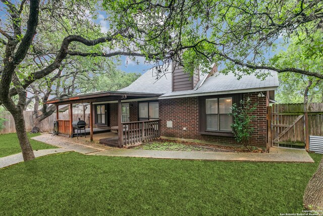 5615 Timber Bark, San Antonio, TX 78250 - rear view of house with brick siding