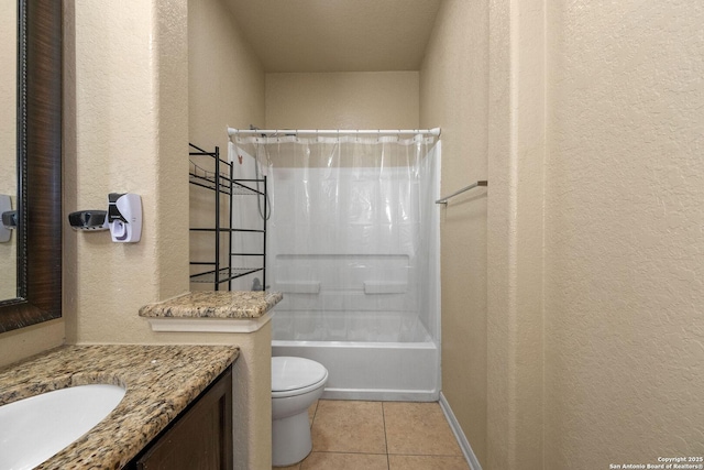 full bathroom with a textured wall, toilet, vanity, tile patterned flooring, and shower / bath combo with shower curtain